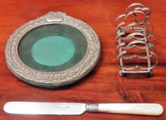 Small silver photo frame, mother of pearl handled knife, plus silver? toast rack