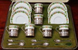 Cased set of Six Shelley coffee cups and saucers, with hallmarked silver mounts, plus spoons