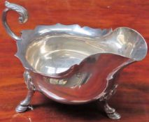 Hallmarked silver sauce boat by Walker and Hall, Sheffield. Weight 208.1G Reasonable used condition