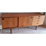 Wrighton mid 20th century teak four drawer long john sideboard with sliding doors. App. 73.5cm H x