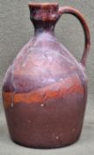 Glazed studio pottery jug, initialled TJM to base. App. 30cm H