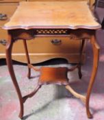 Early 20th century mahogany shaped topped and piercework decorated two tier parlour table