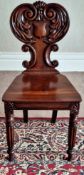 Oak carved back hall chair. App. 87cm H x 43cm W x 35cm D