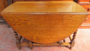 Early 20th century barley twist oak gateleg dining table. App. 70cm H x 107cm W x 149cm D
