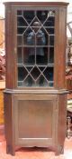 Early 20th century carved oak astragal glazed corner display cabinet