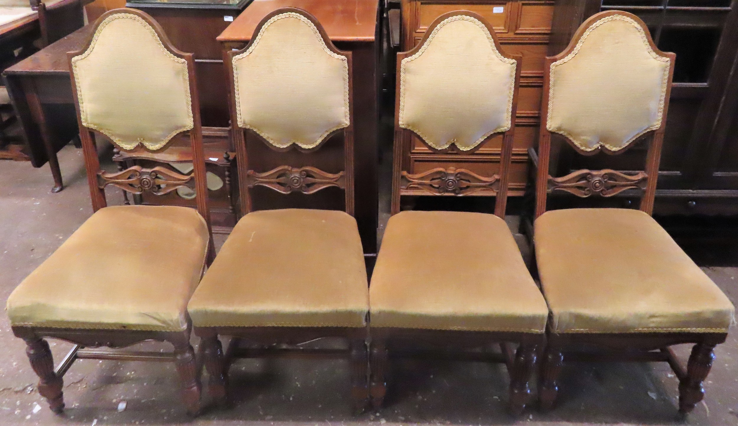 Set of Four early 20th century carved mahogany upholstered high back dining chairs