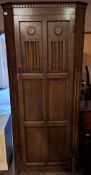 Oak linen fold fronted single door hall wardrobe. App. 182.5cm H x 80cm W x 43cm D