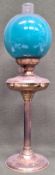 Brass column form oil lamp with glass shade. App. 70cm H