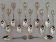Set of twelve hallmarked silver golfing related spoons, birmingham assay dated 1973 by Toye, Kenning