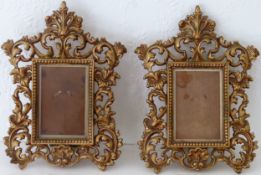 Pair of 20th century piercework decorated brass photograph frames. App. 29cm H