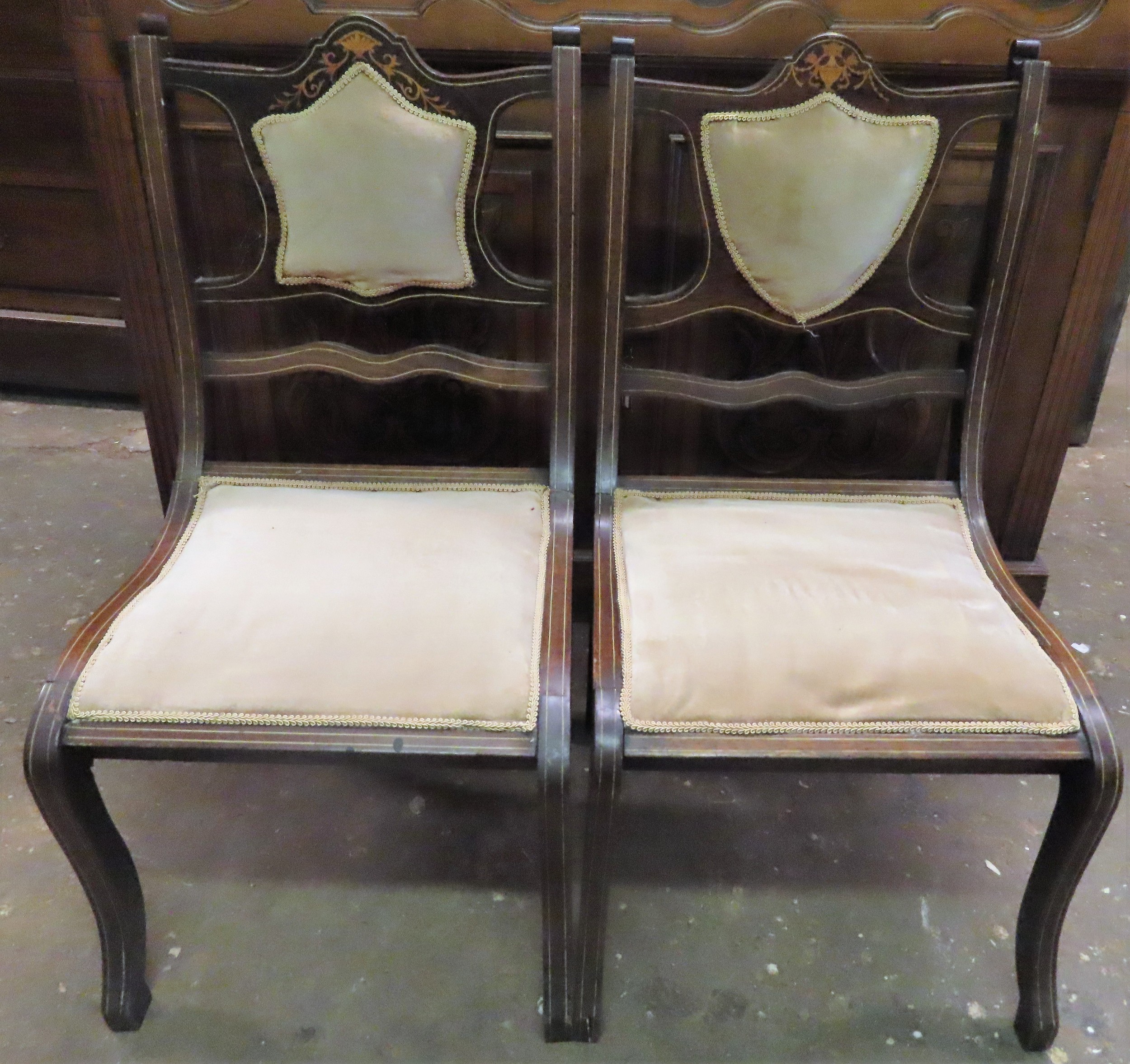 Pair of Edwardian mahogany inlaid and upholstered low bedroom chairs