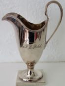 Hallmarked silver stemmed milk jug. London assay dated 1973 by A. Chick & Sons Ltd. App. 16cm H,