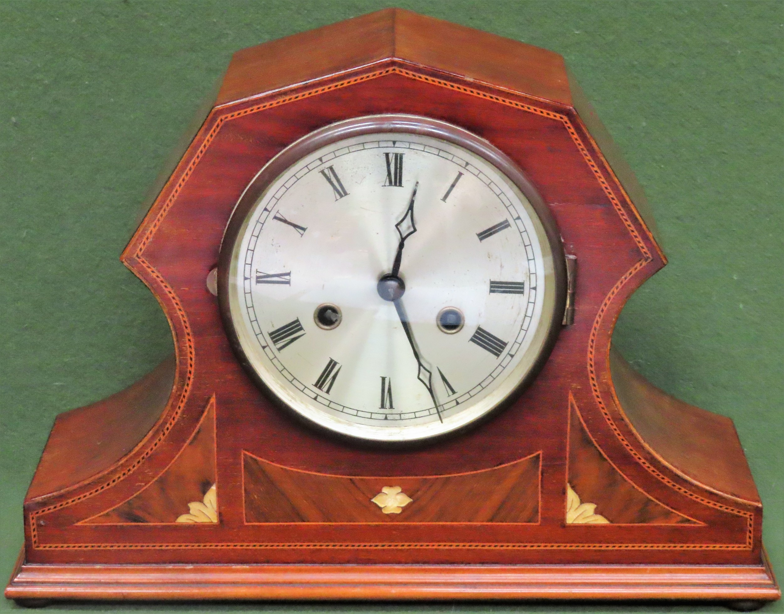 20th century Mahogany inlaid mantle clock, with silver coloured dial. App. 28cm H