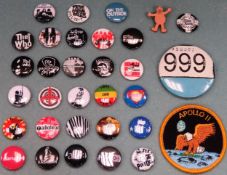 Large quantity of various badges including Kasabian, The Sex Pistols, The Who, Apollo Eleven etc