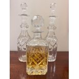 A PAIR OF GLASS DECANTERS PLUS ONE OTHER, APPROX 33cm HIGH AND 26cm