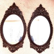 PAIR OF HIGH QUALITY CARVED OAK PIERCEWORK DECORATED OVAL WALL MIRRORS