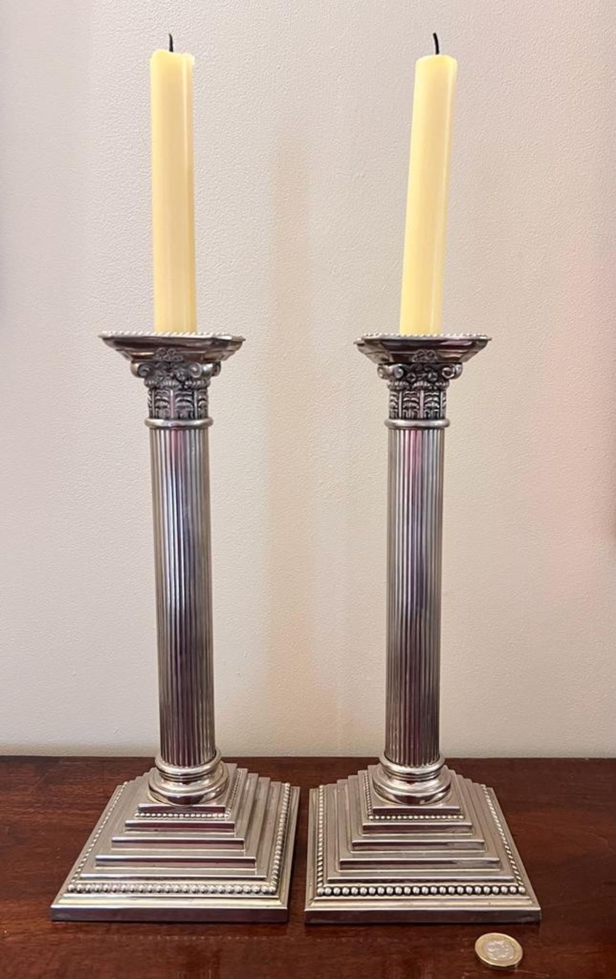 PAIR OF CORINTHIAN COLUMN CANDLESTICKS UPON STEPPED SQUARE BASES, APPROX 30cm HIGH