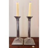 PAIR OF CORINTHIAN COLUMN CANDLESTICKS UPON STEPPED SQUARE BASES, APPROX 30cm HIGH