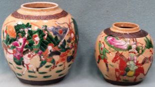 Two similar Oriental ginger jars, hand painted with battle scenes. Largest Approx. 18cms H