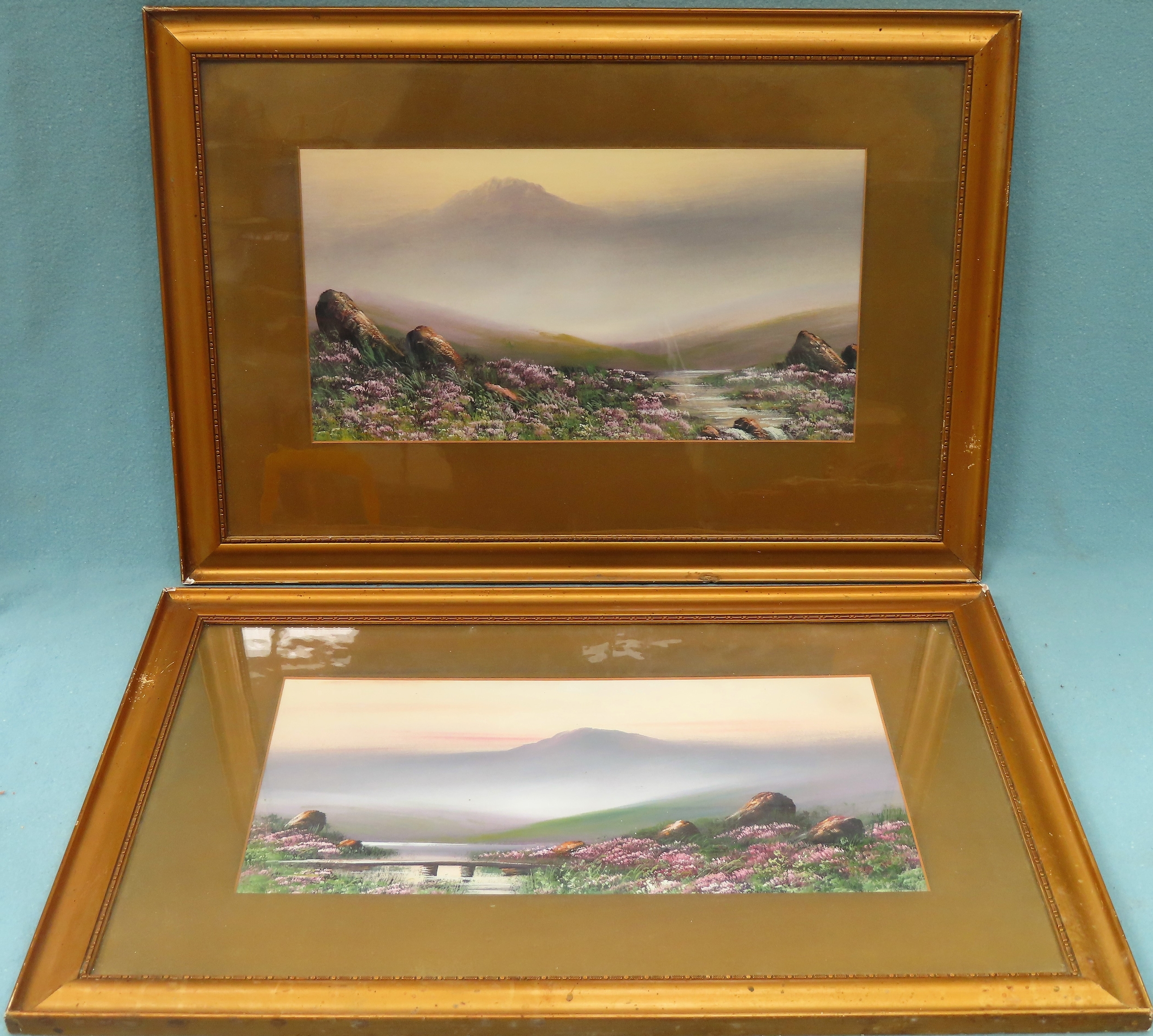 Pair of gilt framed paintings depicting country lakeside scenes, unsigned. Approx. 23cms x 43cms