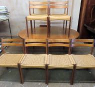 G Plan mid 20th century teak extending dining table with one leaf, plus eight chairs