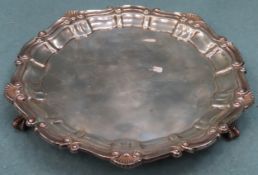 Hallmarked silver wave edged salver on raised claw supports, Birmingham assay. Approx. 196.8g