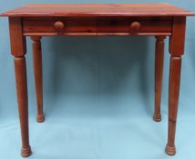 20th century two drawer pine side table. Approx. 72cms H x 82cms W x 39cms D