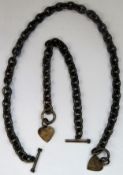 Two silver coloured Albert style watch chains, both with heart shaped fobs. Approx. 129.9g
