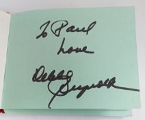 Autograph book including Bob Wooler x 2, Roger McGuinn, Peter Noone, Debbie Reynolds and others.