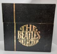 The Beatles Singles Box set black box with gold print includes 25 singles, the Get Back/I’ve Had