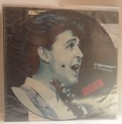 A collection of Paul McCartney records including Spies Like Us 12” Picture Disc, Ebony & Ivory