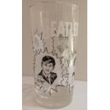 The Beatles gold rimmed glass measuring 5.5" tall by 2 3/4" diameter with images of each Beatle