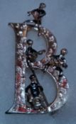 Beatles B brooch, large letter B featuring 4 figures perched on it.