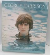 George Harrison Living In The Material World book signed by Olivia Harrison.