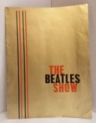 The Beatles Show gold cover programme.