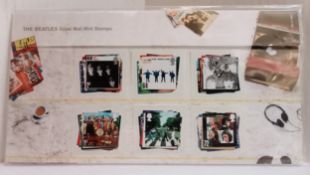 The Beatles set of Royal Mail Beatles stamps and postcards.