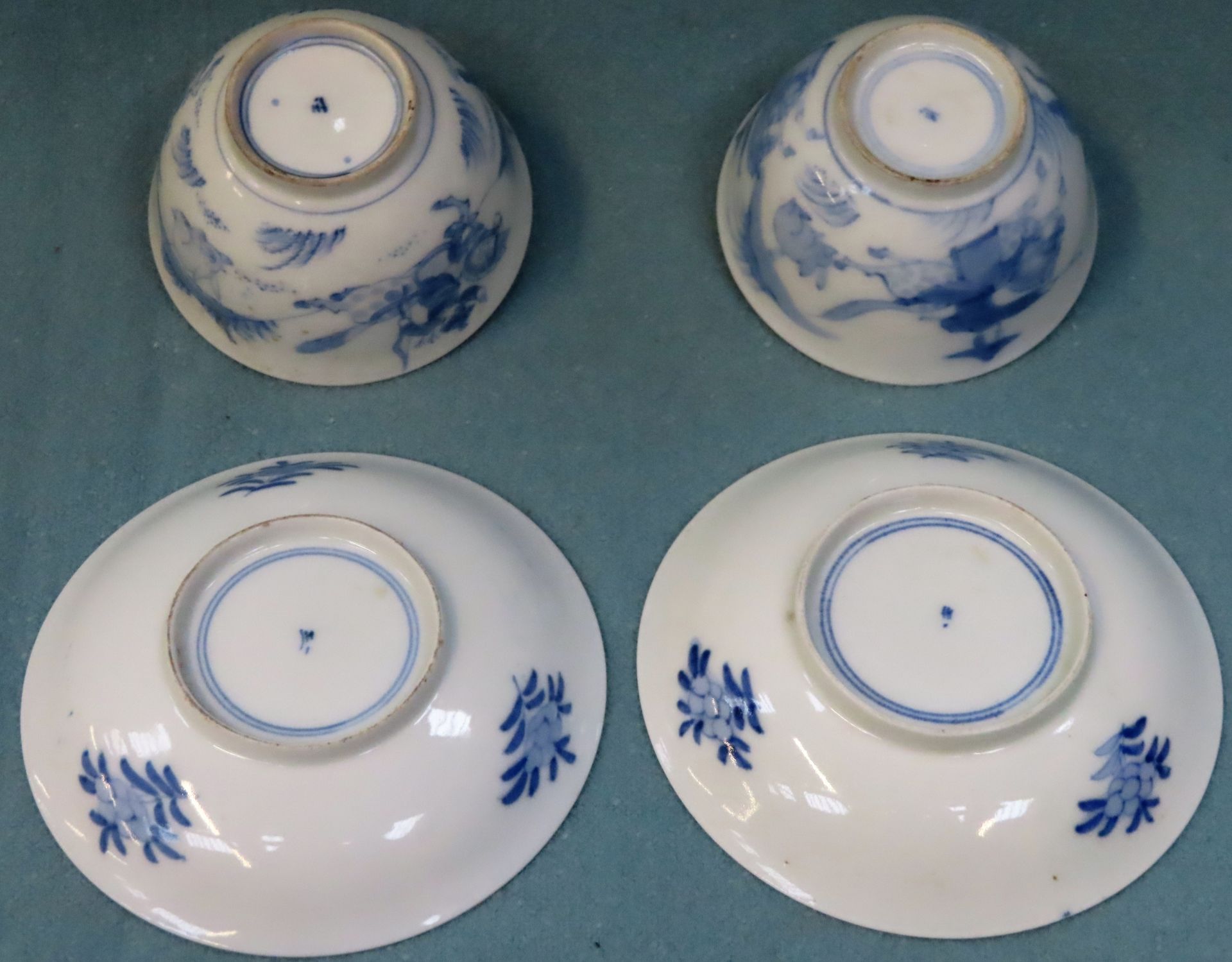 Two similar Oriental blue and white glazed ceramic tea bowls and saucers reasonable used condition - Image 3 of 3