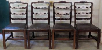 Set of four 19th century mahogany piercework decorated ladder back dining chairs