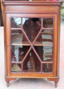 Edwardian mahogany single door wall mounting corner cabinet. App. 84cm H x 58cm W x 29cm D