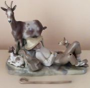 Large Lladro glazed ceramic figure group depicting animals and a young boy sleeping. Approx. 35cm