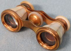 Pair of vintage french gilt metal and mother of pearl decorated adjustible opera glasses Appear in