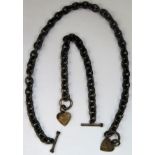 Two silver coloured Albert style watch chains, both with heart shaped fobs. Approx. 129.9g