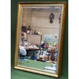 20th century gilded and bevelled wall mirror. Approx. 75cms x 49cms