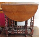 Small early 20th century oak barley twist drop leaf table. App. 76cm H x 69cm W x 84cm D