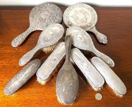 TWO SILVER BACKED DRESSING TABLE MIRRORS AND SEVEN SILVER BACKED VARIOUS BRUSHES