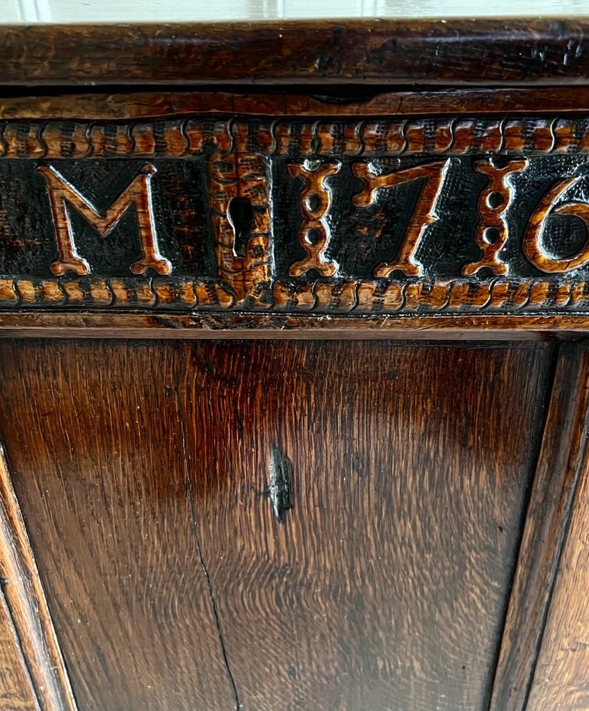 ANTIQUE OAK THREE PANEL CHEST UPON STILE SUPPORTS, DATE 1716 CARVED INTO FRONT PANEL, APPROX 73cm - Image 4 of 4