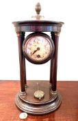 WOODEN MANTLE CLOCK SUPPORTED BETWEEN FOUR COLUMNS, APPROX 32.5cm HIGH