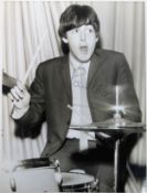 SIGNED ORIGINAL UNPUBLISHED PHOTOGRAPH OF PAUL McCARTNEY PLAYING THE DRUMS, TAKEN AT CAIRD HALL,