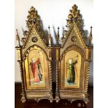 PAIR OF ELABORATE AND GILDED AND CARVED ARCHED FRAMES ENCLOSING IMAGES OF GILDED ANGELS, EARLY