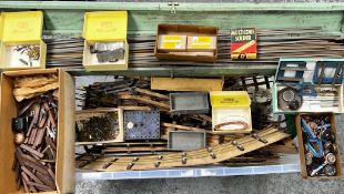 AN ACCUMULATION OF SPARE MODEL TRAIN PARTS, ETC, AND LARGE QUANTITY OF O GAUGE TRACK, ETC.